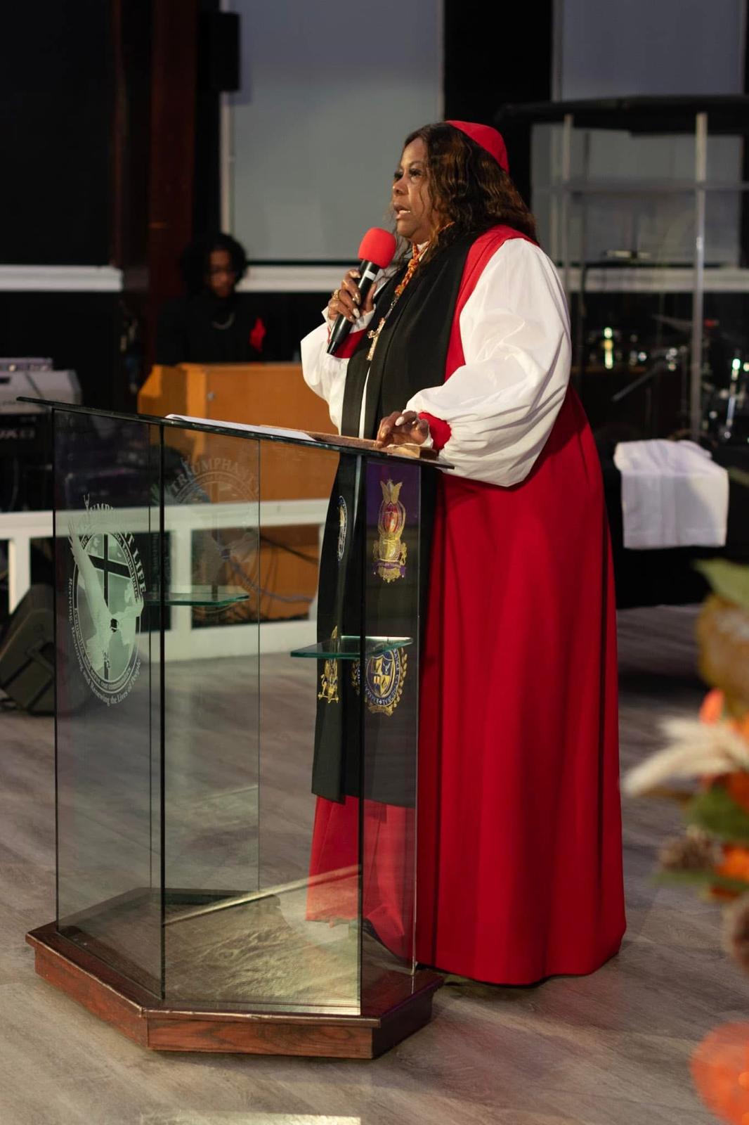 Pastor Laura on the pulpit